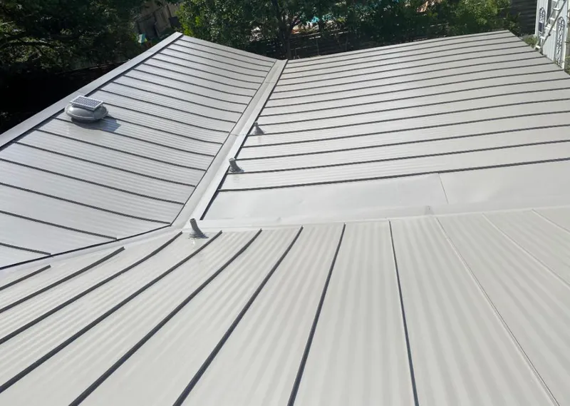 Solar attic fan installed on a metal roof for Roof Ventilation in Straban